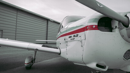 Single propeller aircraft passenger plane in landed position, not in flight.