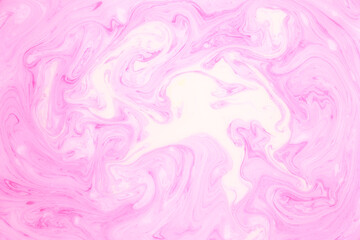 Abstract colored marble background, stains of pink paint on the surface of the water. Liquid colorful backdrop.