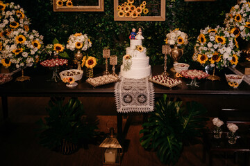 wedding decoration - wedding table with cake, sweets and flowers