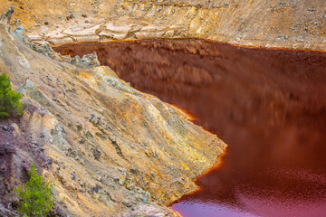 The Amazing Unusual Red Bloody Lake in the Abandoned Career for the Extraction of Gold and Other Colored Metals, Oxidized by Copper and Iron The Unusual Rare Appearance Lake on Cyprus Island
