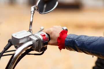 hands on the handlebars of a motorcycle