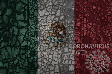 flag of mexico on a old metal rusty cracked wall with text coronavirus, covid, and virus picture.
