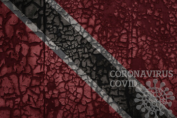flag of trinidad and tobago on a old metal rusty cracked wall with text coronavirus, covid, and...