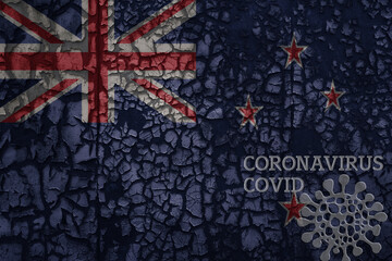 flag of new zealand on a old metal rusty cracked wall with text coronavirus, covid, and virus picture.