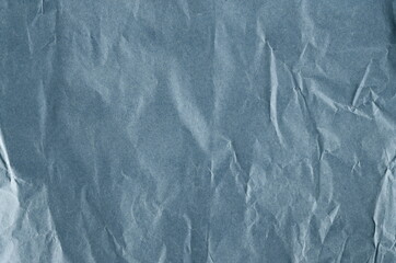 Wrinkly blank blue shopping paper bag texture and background 