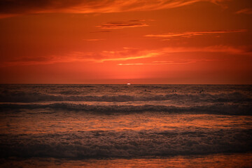 Fototapeta premium Lost surfers in the ocean at the sunset