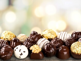Sweet tasty chocolate candy on the desk