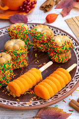 autumn composition, tea and cakes on a wooden table

