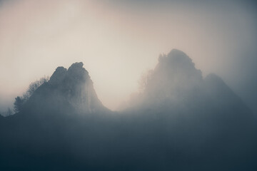 Mysterious black mountain in the fog
