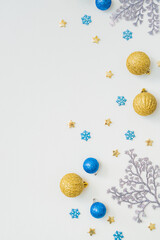 Flat lay frame with christmas balls on a white background. Merry christmas card and copy space for your text