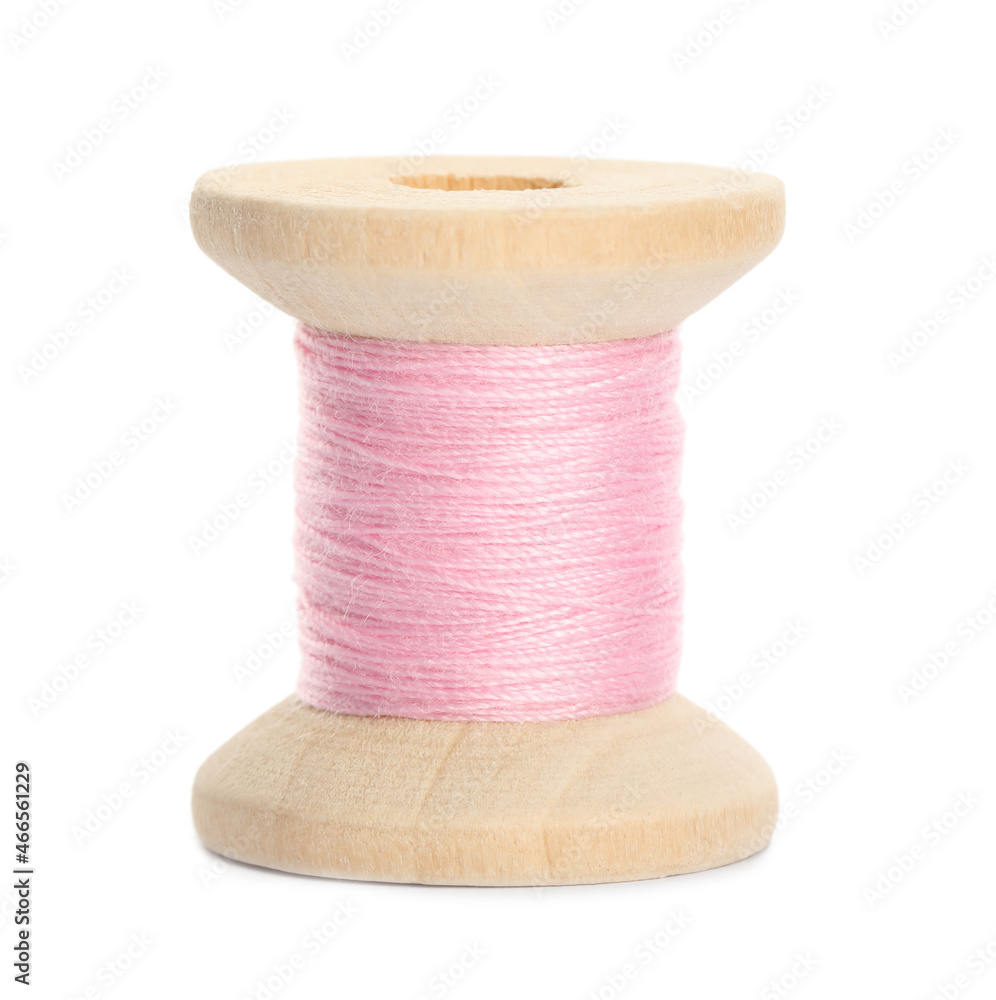 Poster Wooden spool of pink sewing thread isolated on white