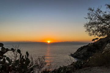 Sunset over the island of Corsica seen from Elba