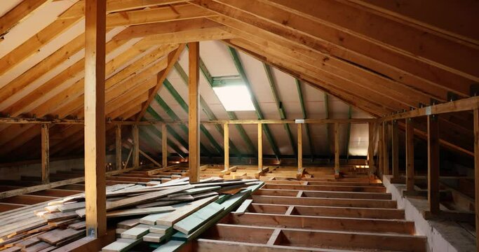 house attic interior under construction. wooden roof frame