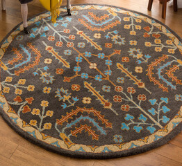 Modern multicolour rounded living area floor rug, interior room floor carpet texture design.