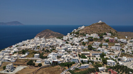 Aerial drone photo of main village of Plaka, main village of Milos island featuring uphill castle and scenic views to Aegean sea, Cyclades, Greece