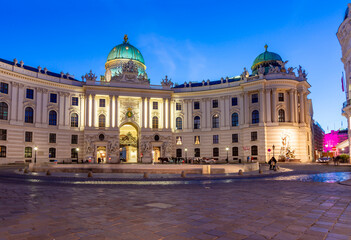 Fototapeta premium Hofburg palace on St. Michael square (Michaelerplatz) at night, Vienna, Austria