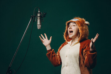 Woman prepares herself and a material before voice recording. Soundproof room for professional...