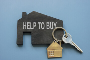 Home with phrase help to buy and real estate key.
