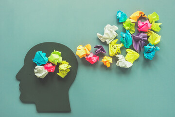 Positive thinking concept. Head shape and colorful paper balls.