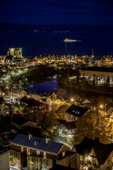 Munkholmen by night with Trondheim and Nidelva in the frame