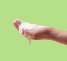 Foam on the hand. Cleaning agent or natural soap