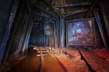 Fototapeta na wymiar Railway in flooded abandoned mine