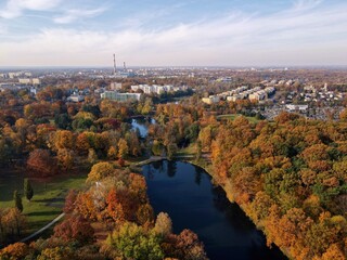 Fototapeta premium Autumn panorama of the city of Lodz .Autumn city park. City ponds and water reservoirs Top view, photo from the drone 