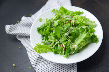 green salad leaves mix fresh herbs petals vitamin fresh meal snack on the table copy space food background rustic 