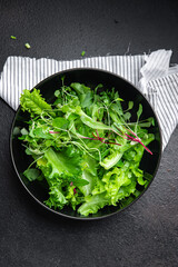 green salad leaves mix fresh herbs petals vitamin fresh meal snack on the table copy space food background rustic 