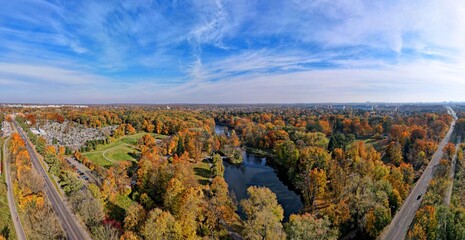 Autumn panorama of the city of Lodz .Autumn  city park. City ponds and water reservoirs Top view, photo from the drone  - obrazy, fototapety, plakaty