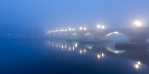 Panorama of the famous Stone Bridge over the Danube river in Regensburg, Bavaria on a cold morning...