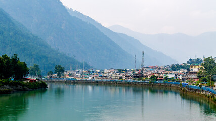 Naklejka premium An aerial view of Uttarkashi town along the Bhagirathi river (Ganga river)