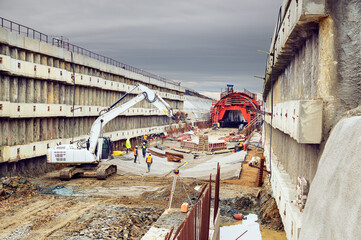 Building of new railway corridor with tunnel. Construction site with workers