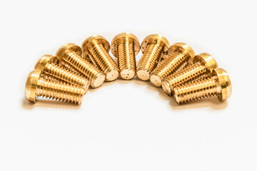 Bronze screws made on a lathe on a white isolated background.