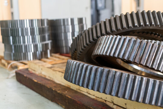 Gear wheels in stock after cutting a tooth on a gear cutting machine.