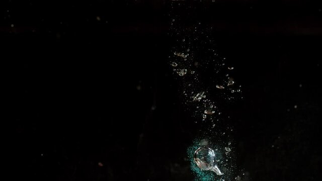 Phantom high speed shooting seashell falls into water