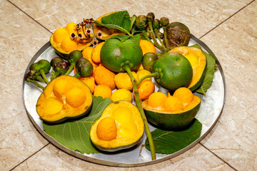 Pequi fruits close-up (Caryocar brasiliense) at various stages of ripening top view 