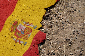 A crisis. Flag on the broken asphalt - Spain