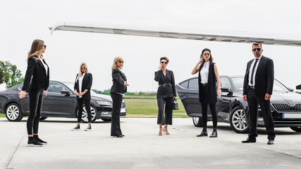 Female male security bodyguards team protect VIP celebrity public person
