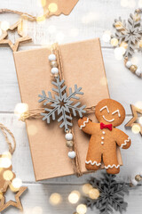 Top view on Christmas gift box wrapped in craft paper. Holidays concept.