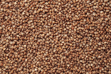 Buckwheat, not boiled, raw, kernel of grain, background, close-up