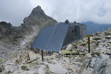 Chata pod Rysmi (meaning Hut under Rysy) is the highest situated chalet in the High Tatras mountains, Slovakia. - obrazy, fototapety, plakaty