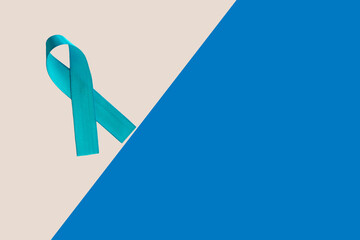 blue ribbon with bow on blue and white background. Blue november. Prevention of prostate cancer....
