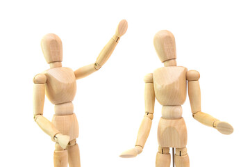 two wooden figures of people communicate