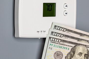Thermostat for home furnace and air conditioner. Utility bill savings, energy cost and conservation...