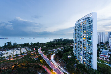 Condominium building overlooking a highway and the Singapore strait