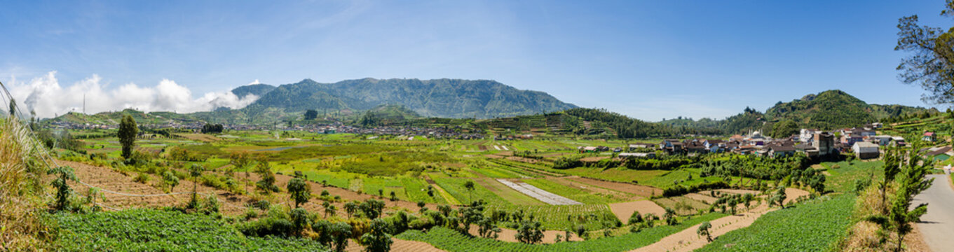 Panorama view of Dieng Plateau, an agricultural valley and sulfur extraction site set in a fertile volcanic crater in Central Java island, Indonesia
