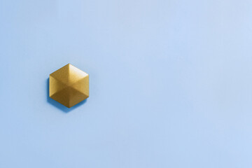 Kinetic toy antistress flipo flip in the form of golden hexagon. Copy space