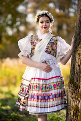 Young beautiful slovak woman in traditional dress. Slovak folklore