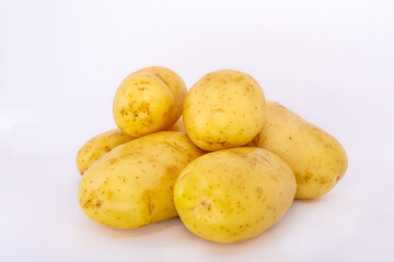 A handful of potatoes on a white background.
